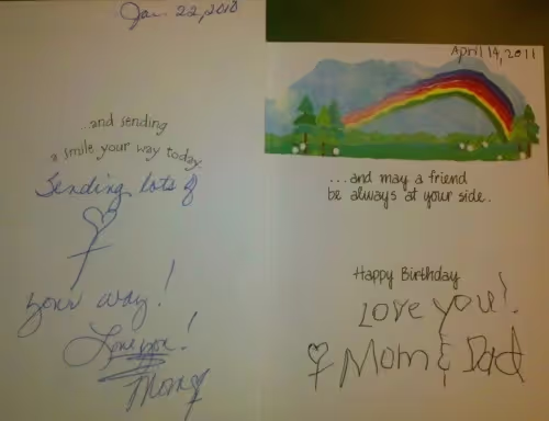 Two handwritten cards from the author's mom, showing how her handwriting changed in a year.