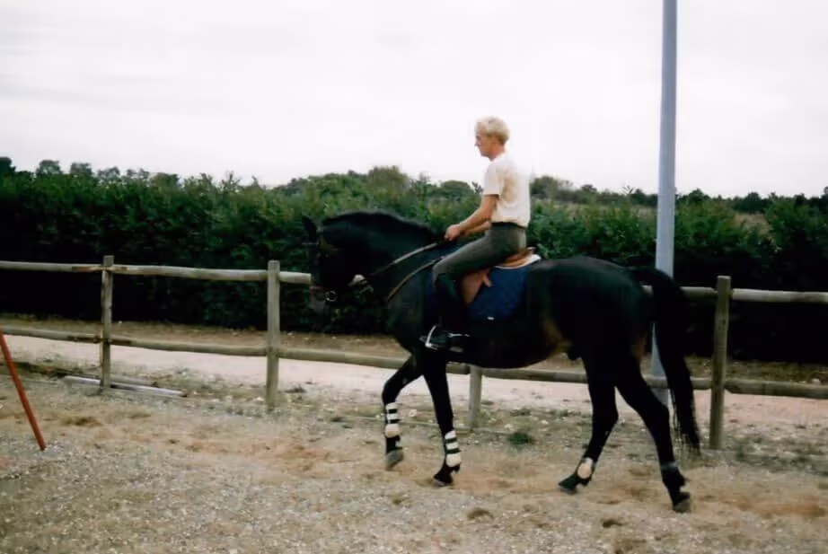 Brooke's dad riding a horse.