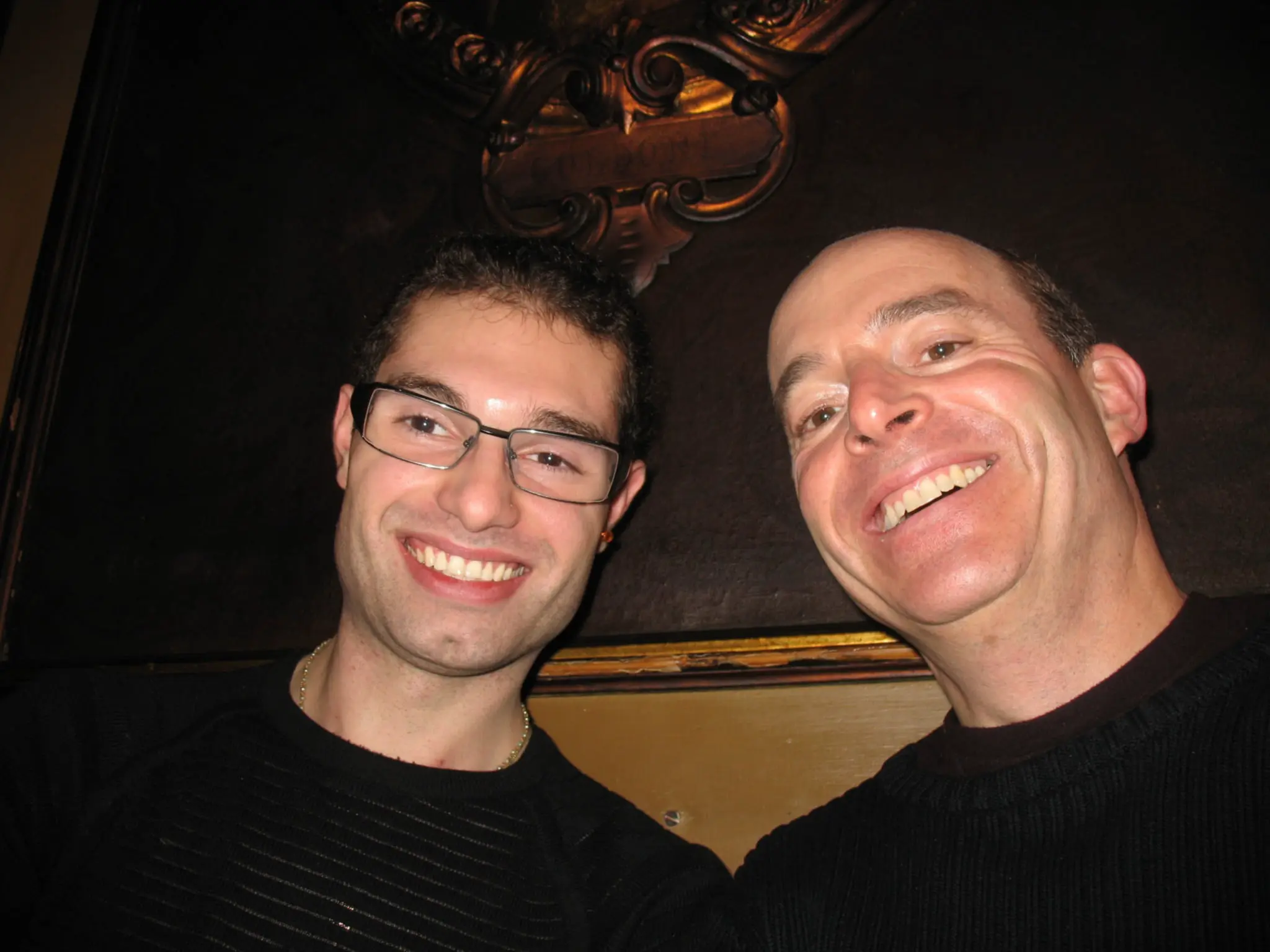 Marco and Jon smiling close together in an early selfie.