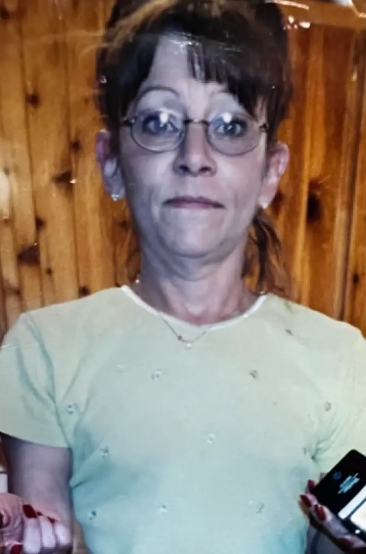 Beth's mom, Judy, in glasses and a mint green top.
