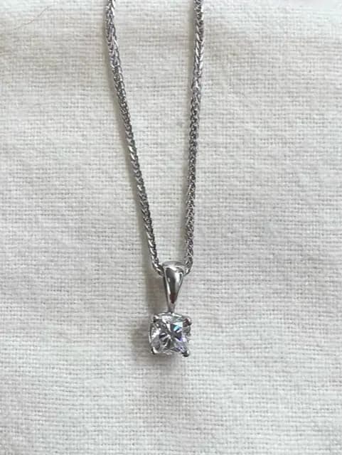 Beth's colorless cushion-cut memorial diamond on a pendant necklace.