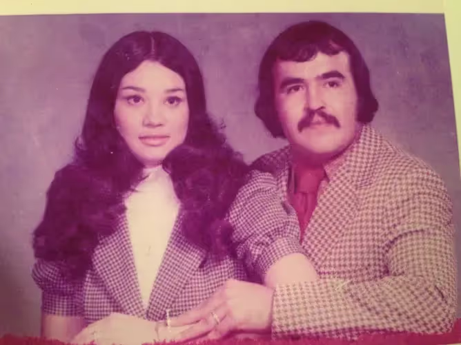 Vintage portrait of a young Benny and Rosa side by side.