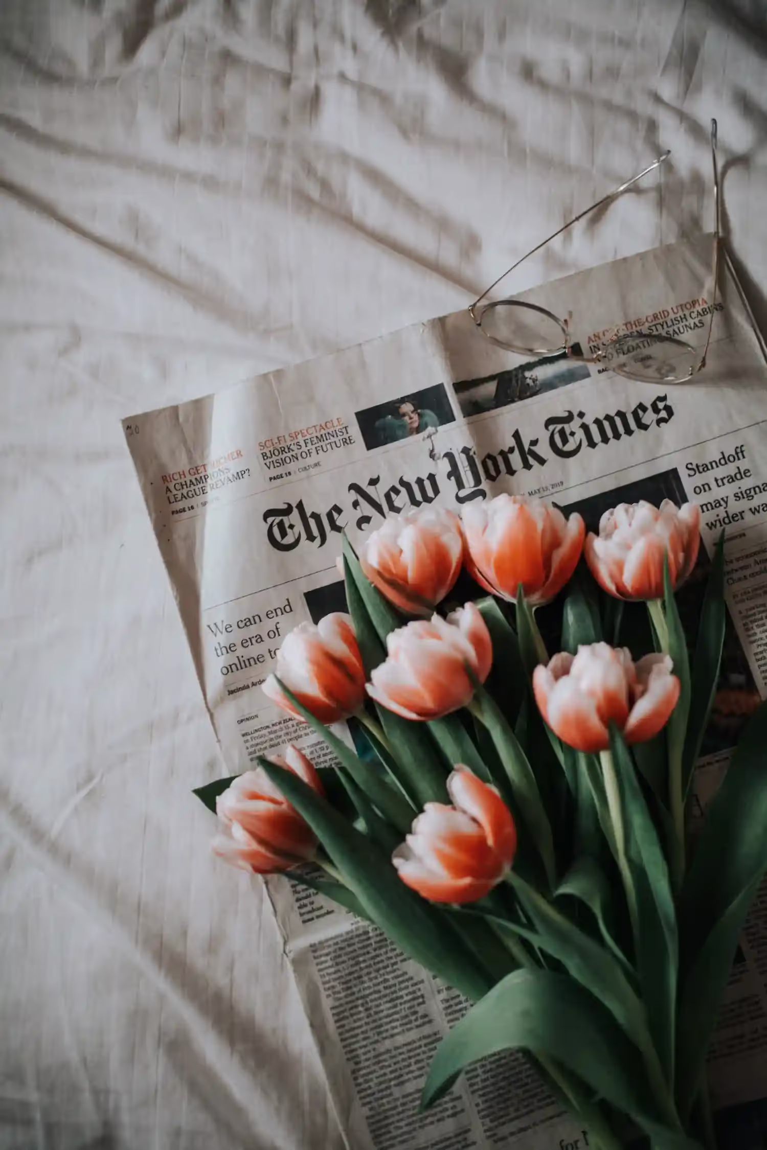 Flowers laid on a newspaper.