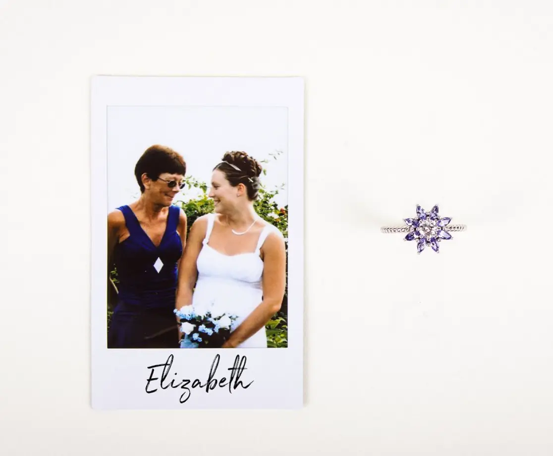 polaroid of mom and daughter next to purple diamond ring