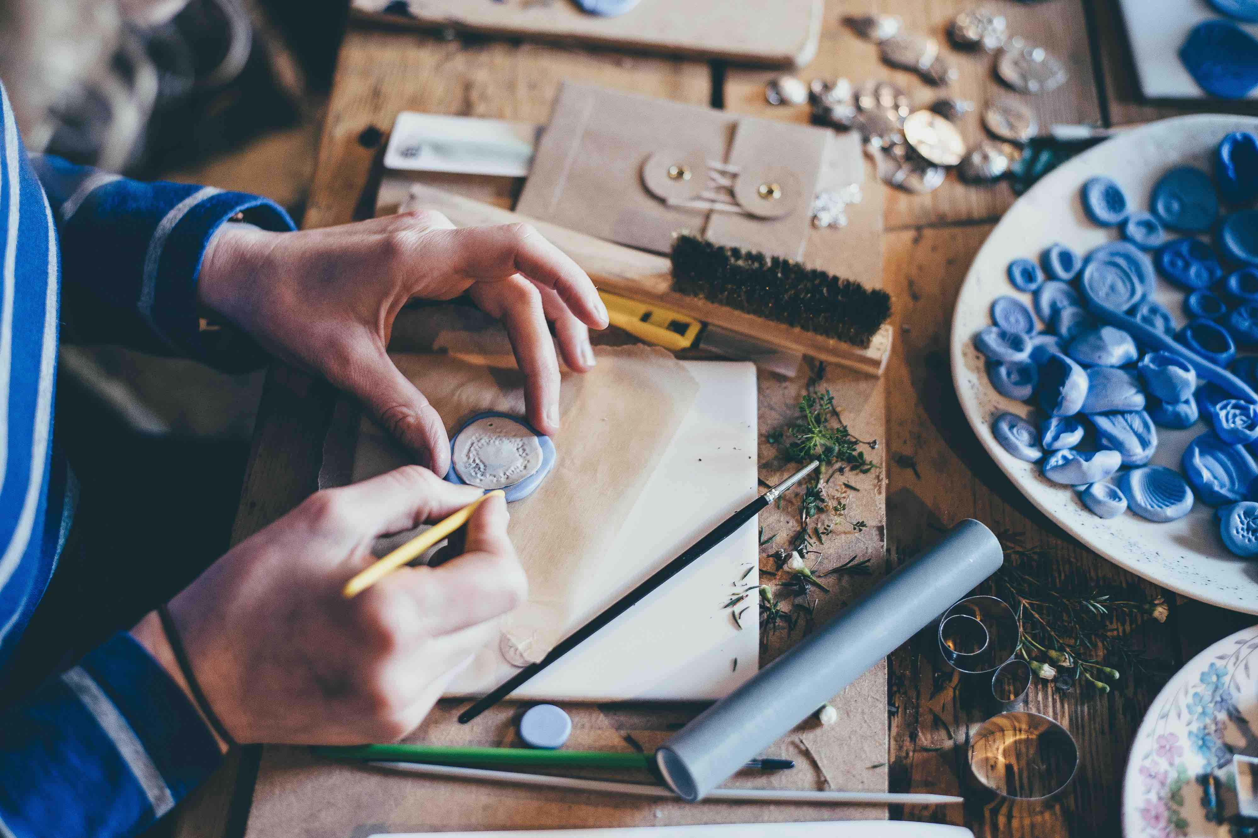 close up of a woman's hands crafting